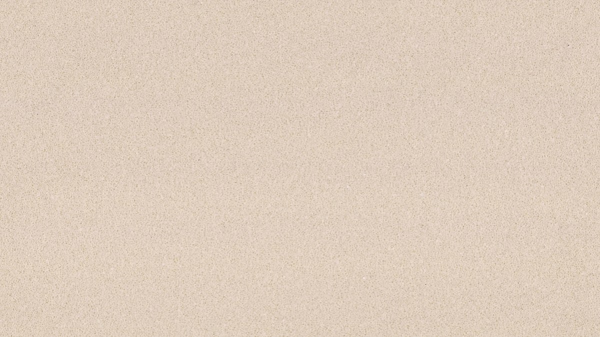 Fine grain beige engineered stone sheet close-up surface detail