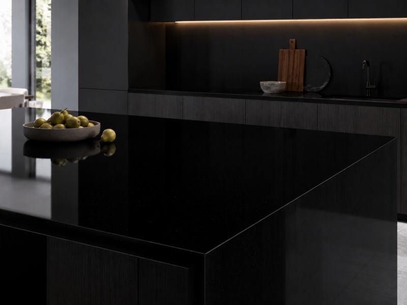 Absolute Black Artificial Marble slab with deep black base and fine micro speckles by Aoli Stone
