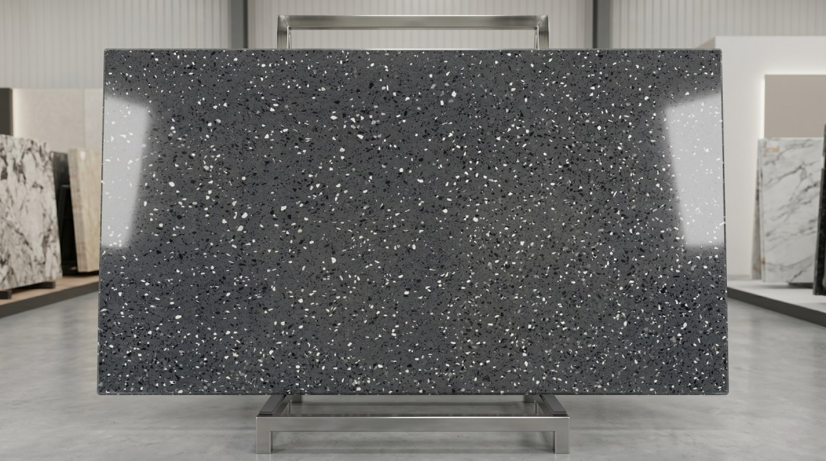 Grey compact marble slab with dense black white and grey chips