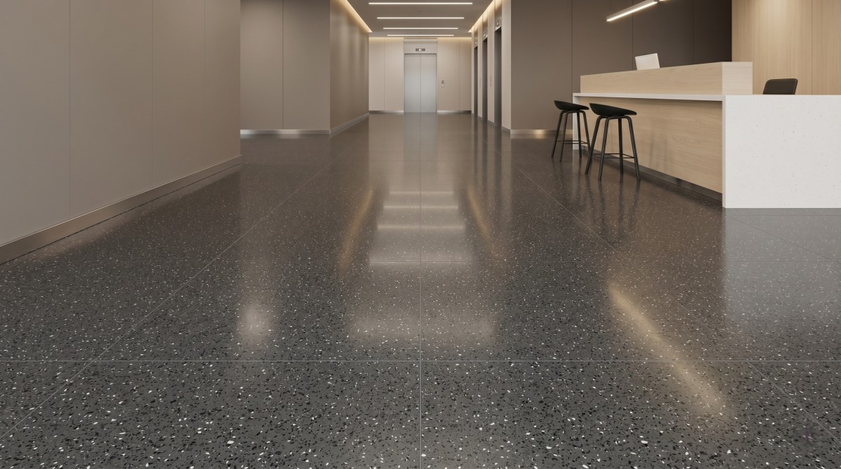 Grey compact marble floor tiles with black and white fragments