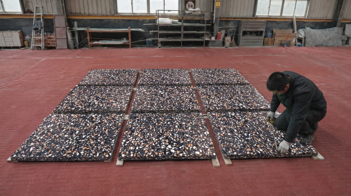 •Amber Night terrazzo cut pieces arranged for dry-lay visual inspection before packing
