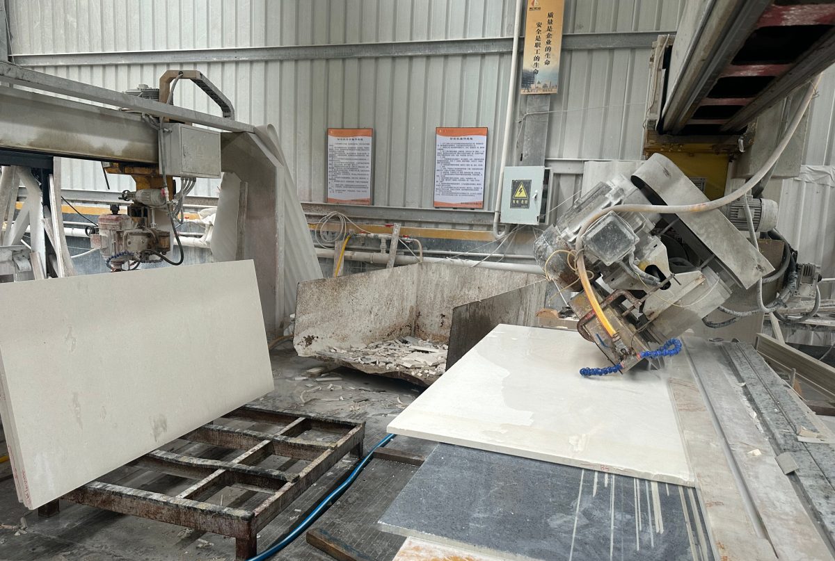 Actual cut-to-size limestone panels on infra cutting machine