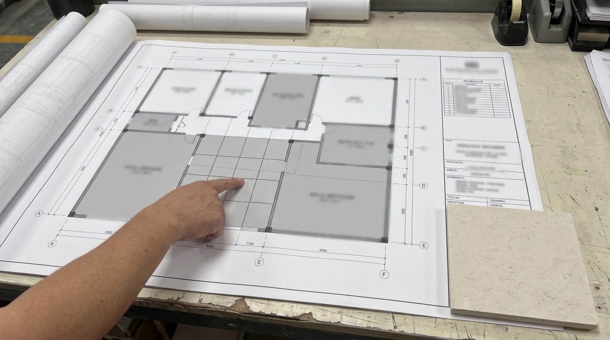 Blurred plan drawing reviewed with limestone piece locations and joint sequence
