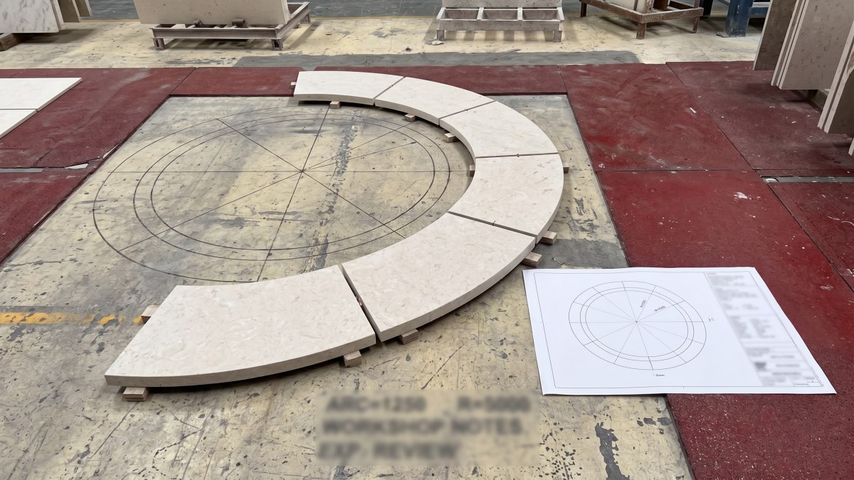 Curved Moonlight Beige Limestone segments reviewed against a blurred radius drawing